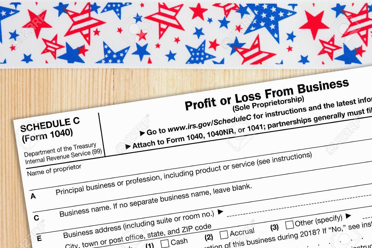 A US Federal Tax 1040 Schedule C Income Tax Form On A Desk With USA Banner Stock Photo Picture And Royalty Free Image Image 119059650 